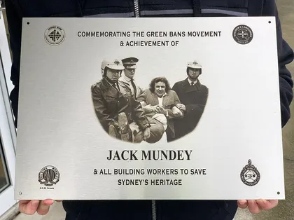 Commemorative heritage plaque with an engraved photo and emblems