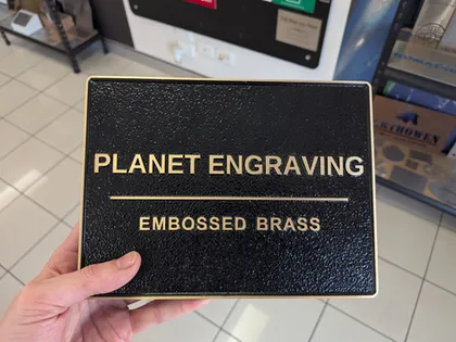 Embossed plaque