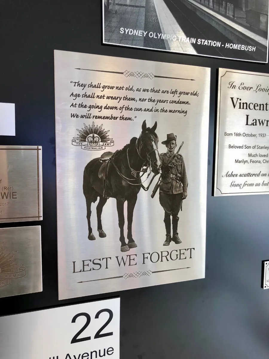 Lest We Forget commemorative plaque with an engraved soldier and horse