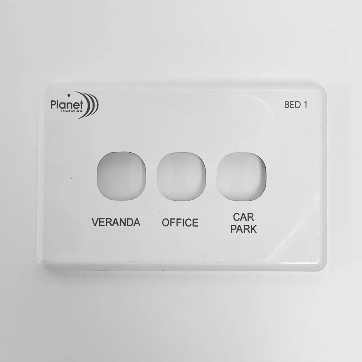 Light switch plate engraved with room labels