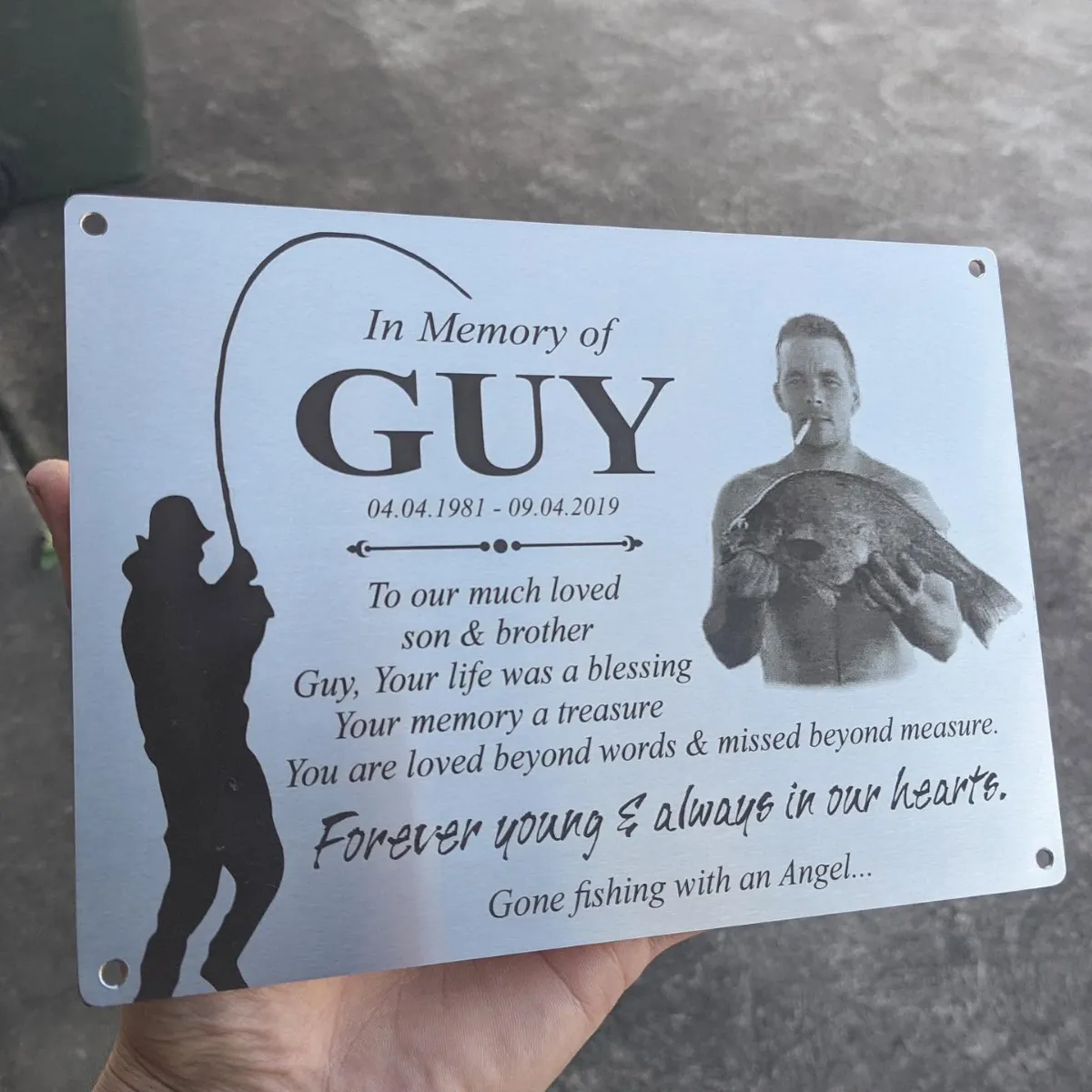 Stainless steel memorial plaque with an engraved photo and fishing silhouette