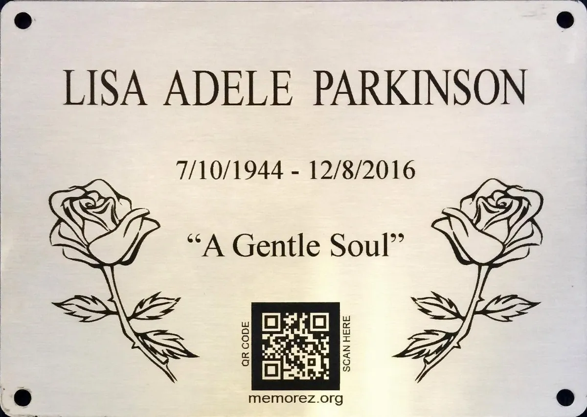 Memorial plaque with engraved roses and a QR code