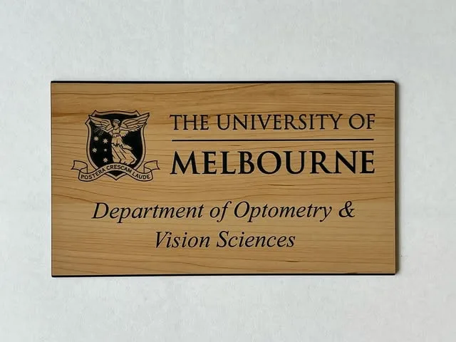 Laser engraved timber university sign