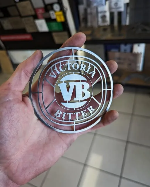 Laser cut stainless steel logo