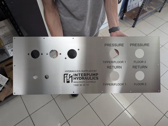 Laser cut and engraved stainless steel hydraulic control panel