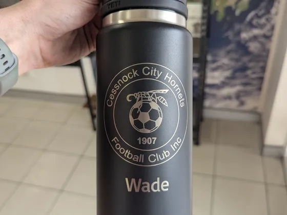 Laser engraved Yeti drink bottle with a football club logo and player name