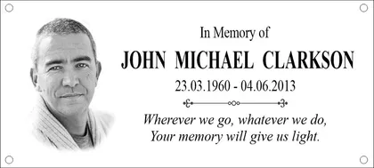 Memorial plaque with a portrait photo and verse
