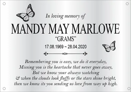 Memorial plaque with butterflies and a verse