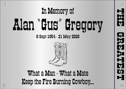 Memorial plaque with cowboy boots and the words What a Man What a Mate