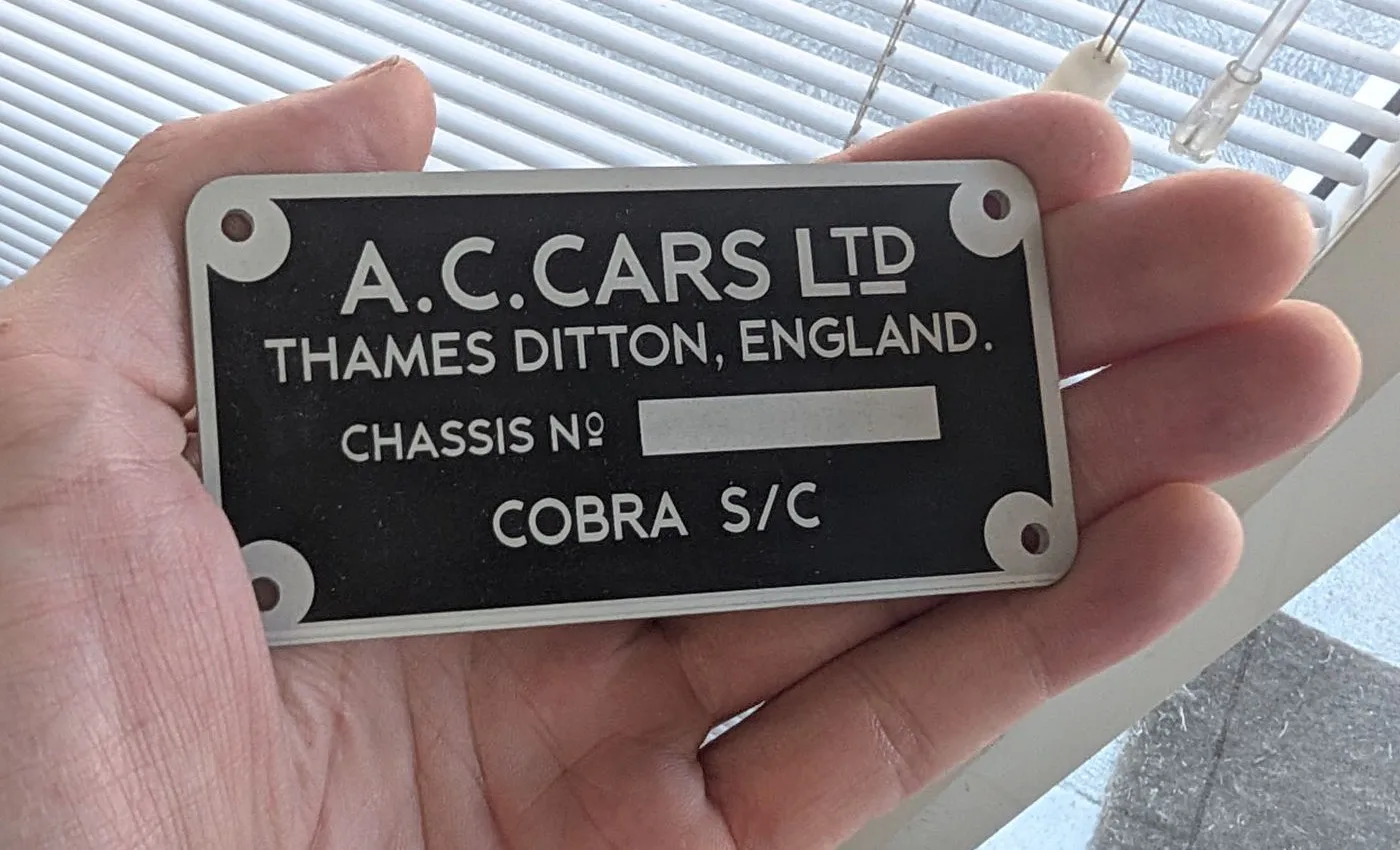Black anodised aluminium chassis plate for a classic car
