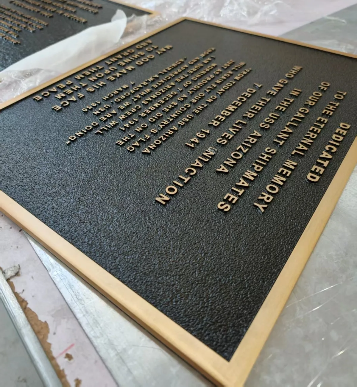 Embossed commemorative plaque with raised lettering