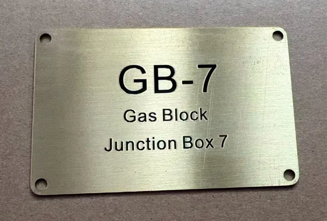 Engraved brass equipment label for a gas block junction box
