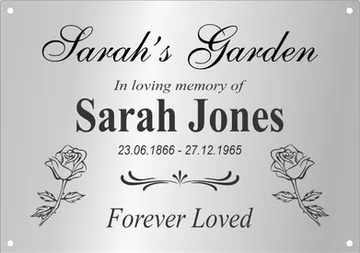 Pet memorial plaque with an engraved pug photo, paw prints and a bone
