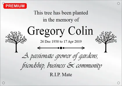 Tree memorial plaque reading This tree has been planted in the memory of